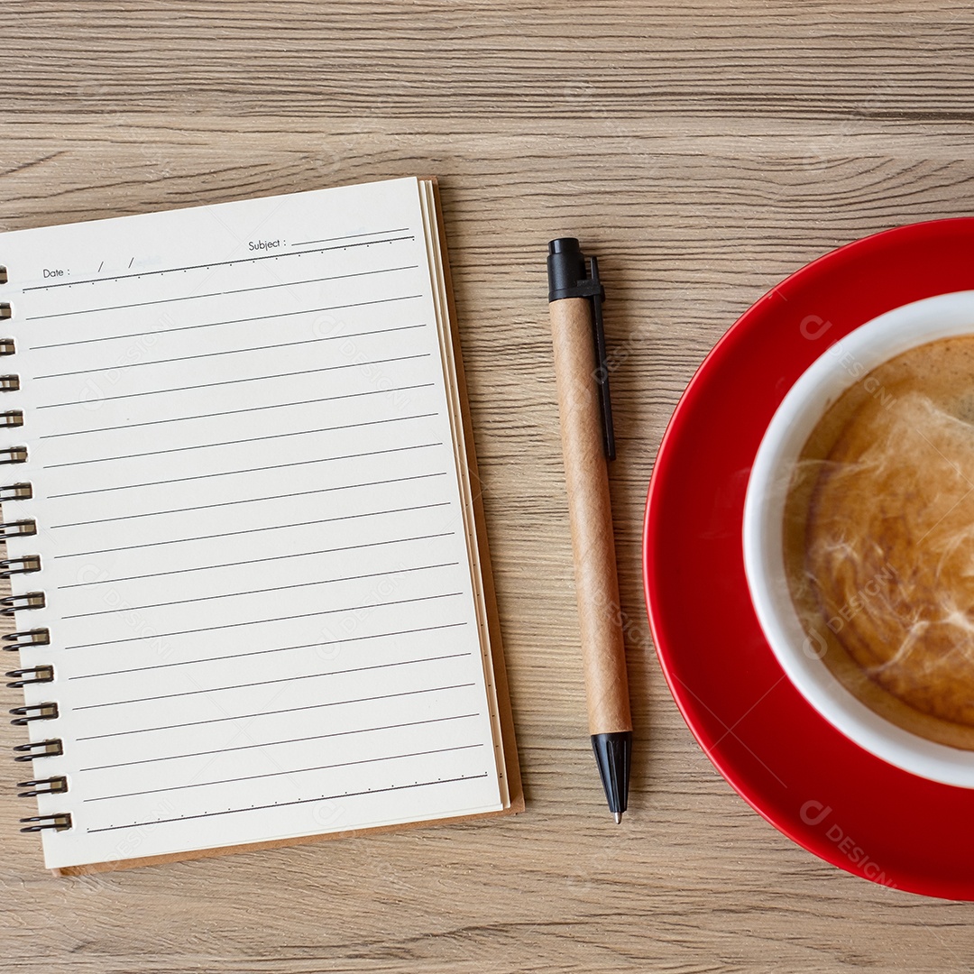 Blank notebook and cup of coffee on wooden table. Motivation, determination