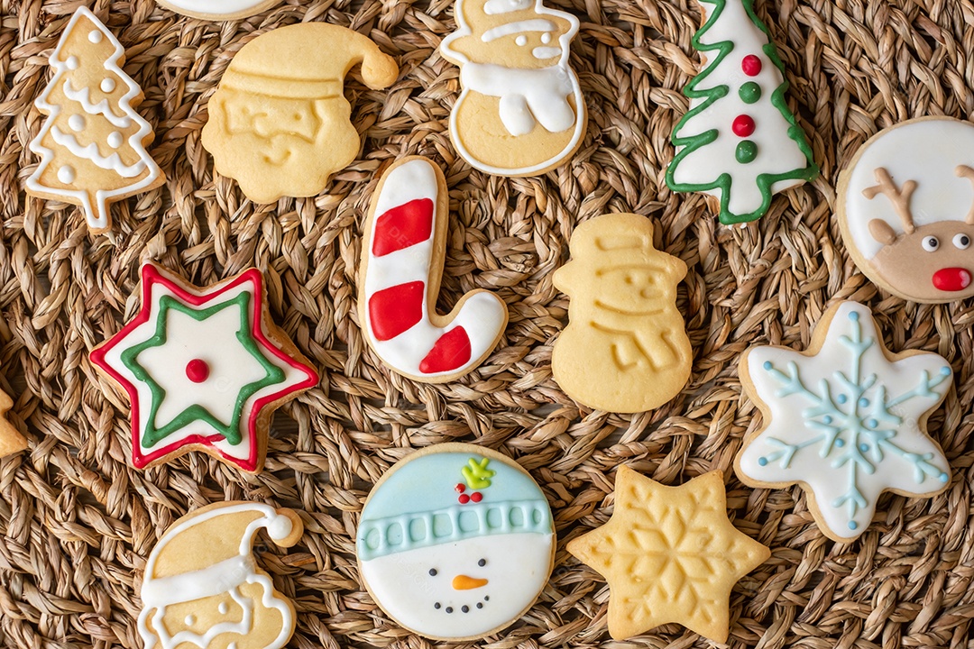 Merry Christmas with homemade cookies on wooden table background.