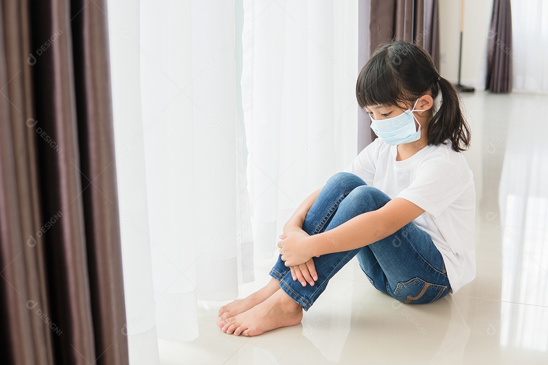 Child in medical mask are isolated at home for self quarantine