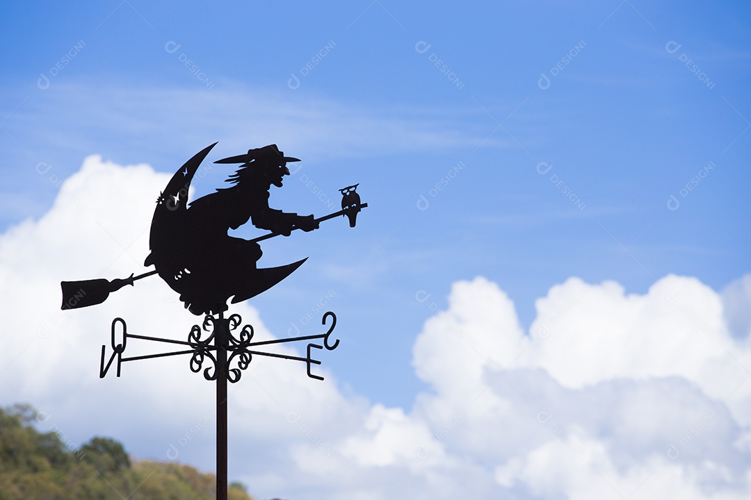 Imagem conceitual de bruxa no cata-vento de cabo de vassoura