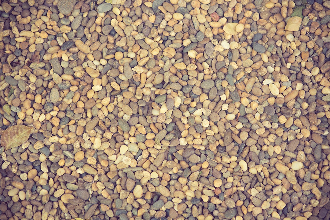 Fundo com cor vintage de pedras redondas secas