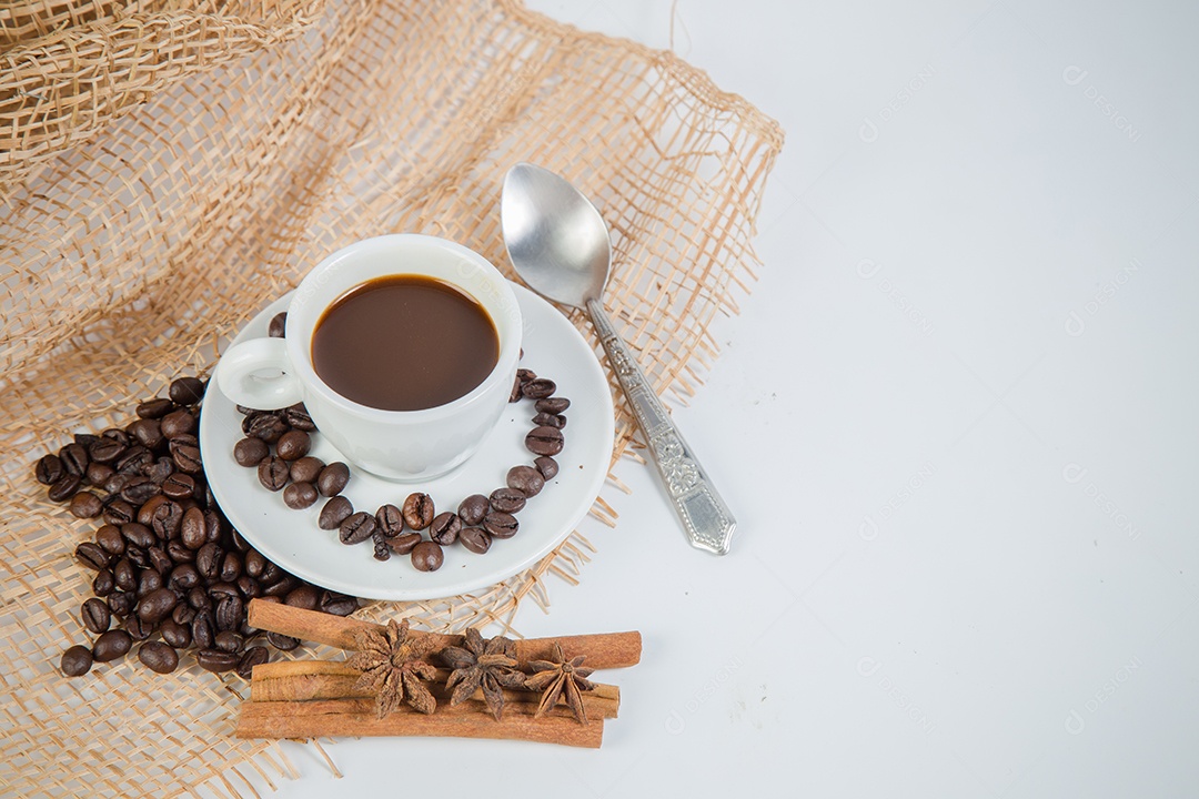 Cup of coffee and beans on a white background.