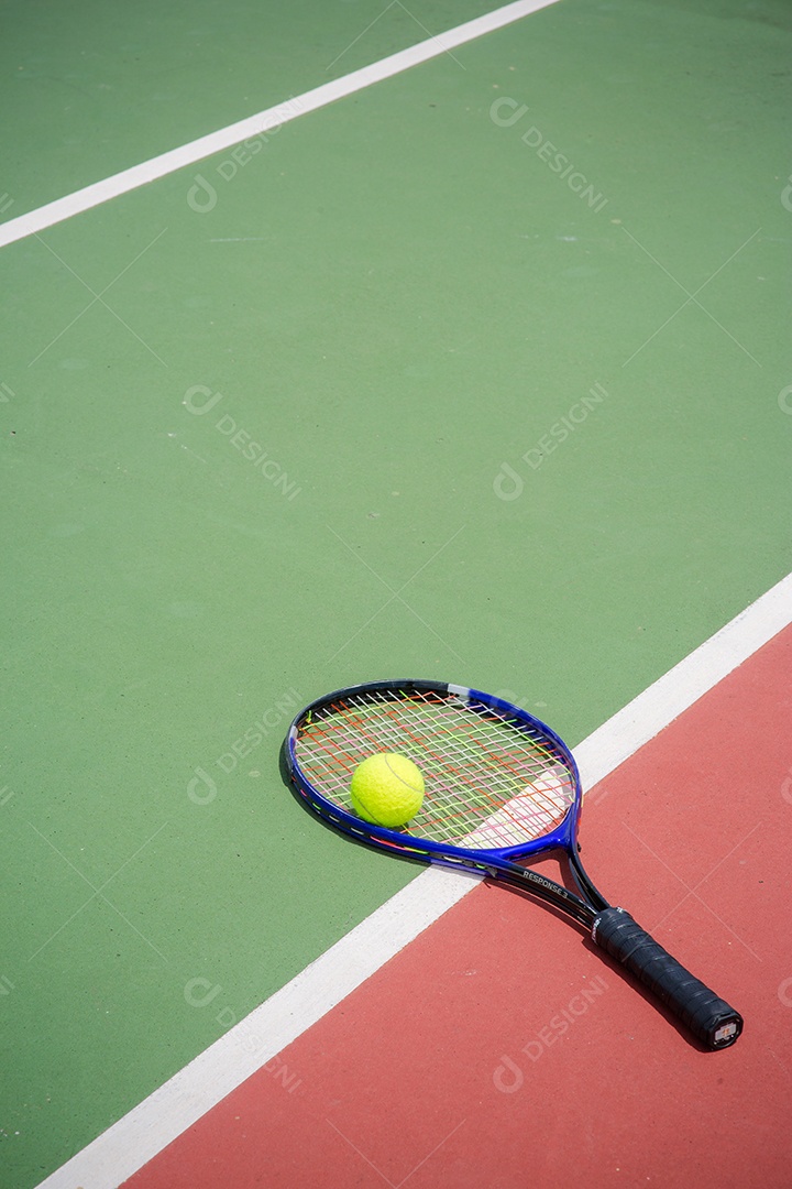 Tennis racket and balls on the tennis court