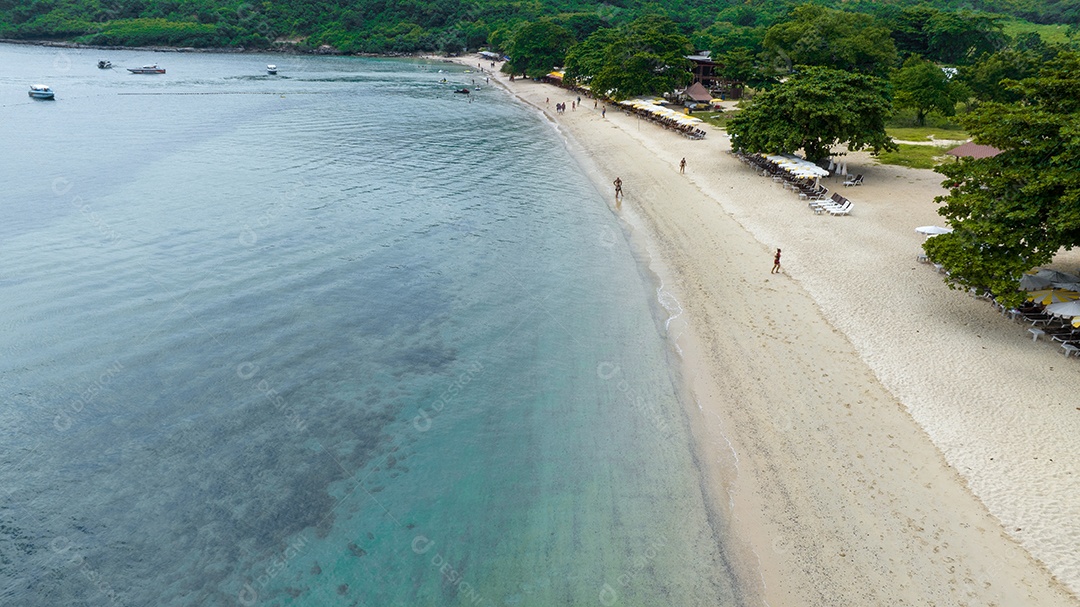 Summer holidays from natural beach concept. Summer tropical beach nature. Umbrella aboard a boat and boat at Praia de Areia e Turismo Happy to play in the sand.