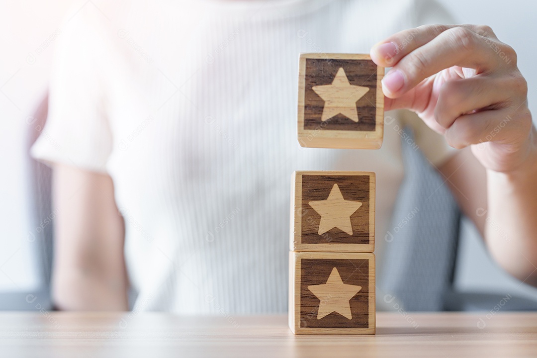 Hand holding Star block. Customer choose rating for user reviews