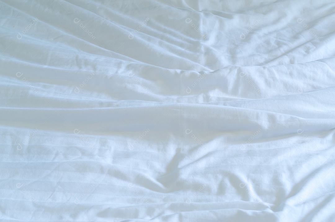 White wrinkled bed linen taken in hotel room