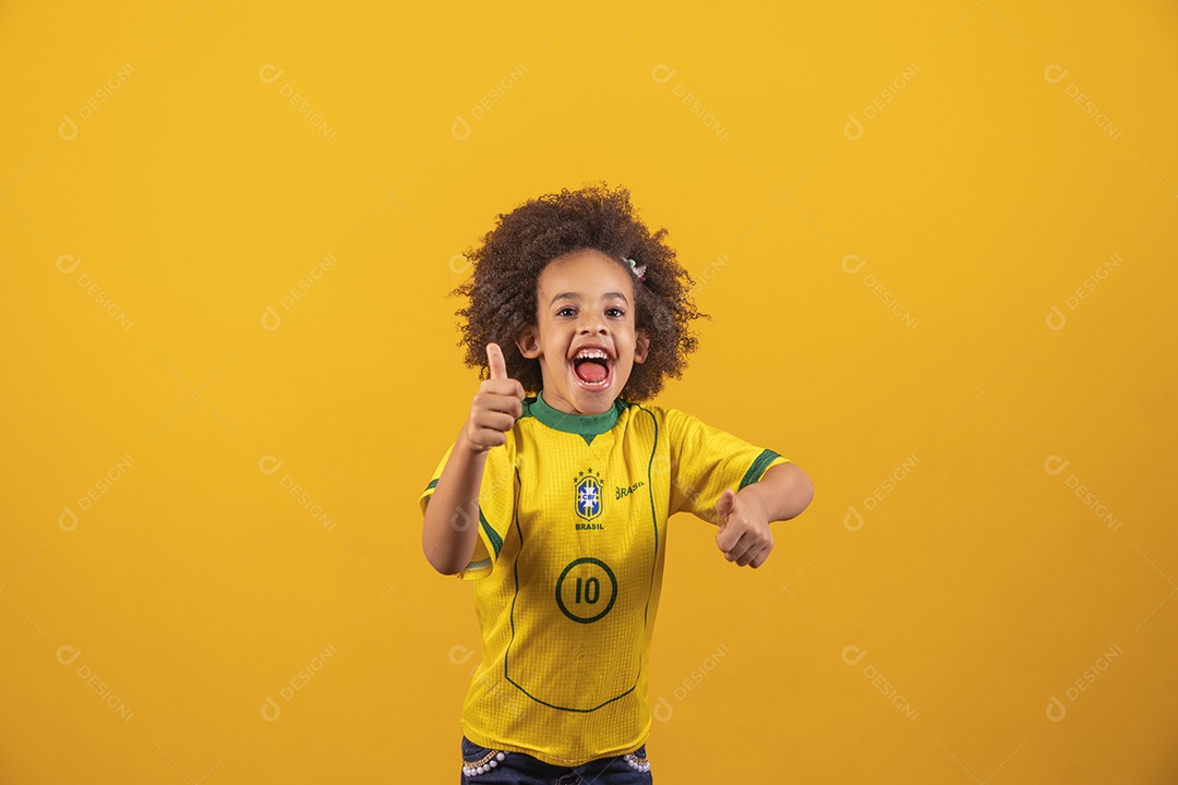Beautiful little girl with afro hair wearing a Brazilian national team shirt