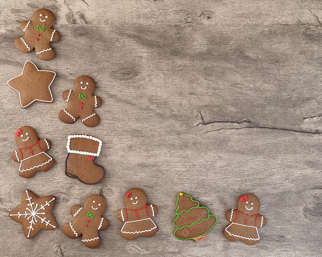 Biscoitos de gengibre de natal tradicionais sobre uma mesa de madeira