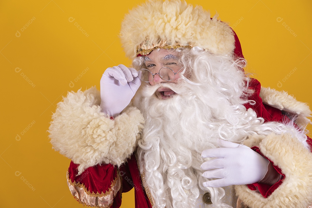 Happy smiling Santa Claus Merry Christmas isolated yellow background