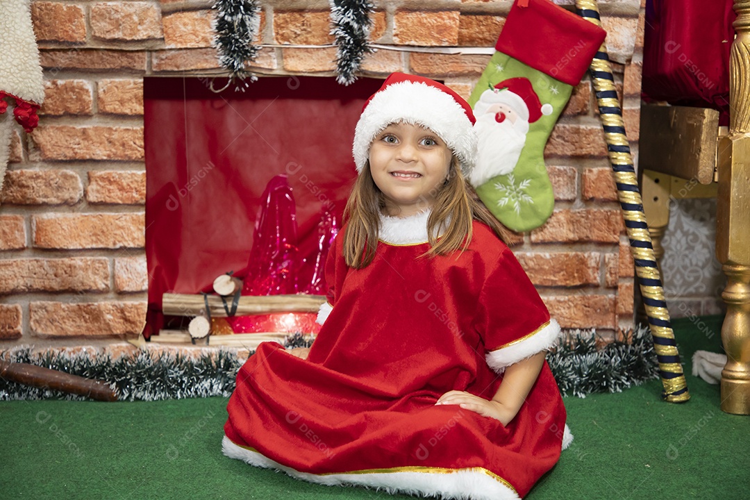 Beautiful girl dressed as Santa Claus wearing Merry Christmas bonnet