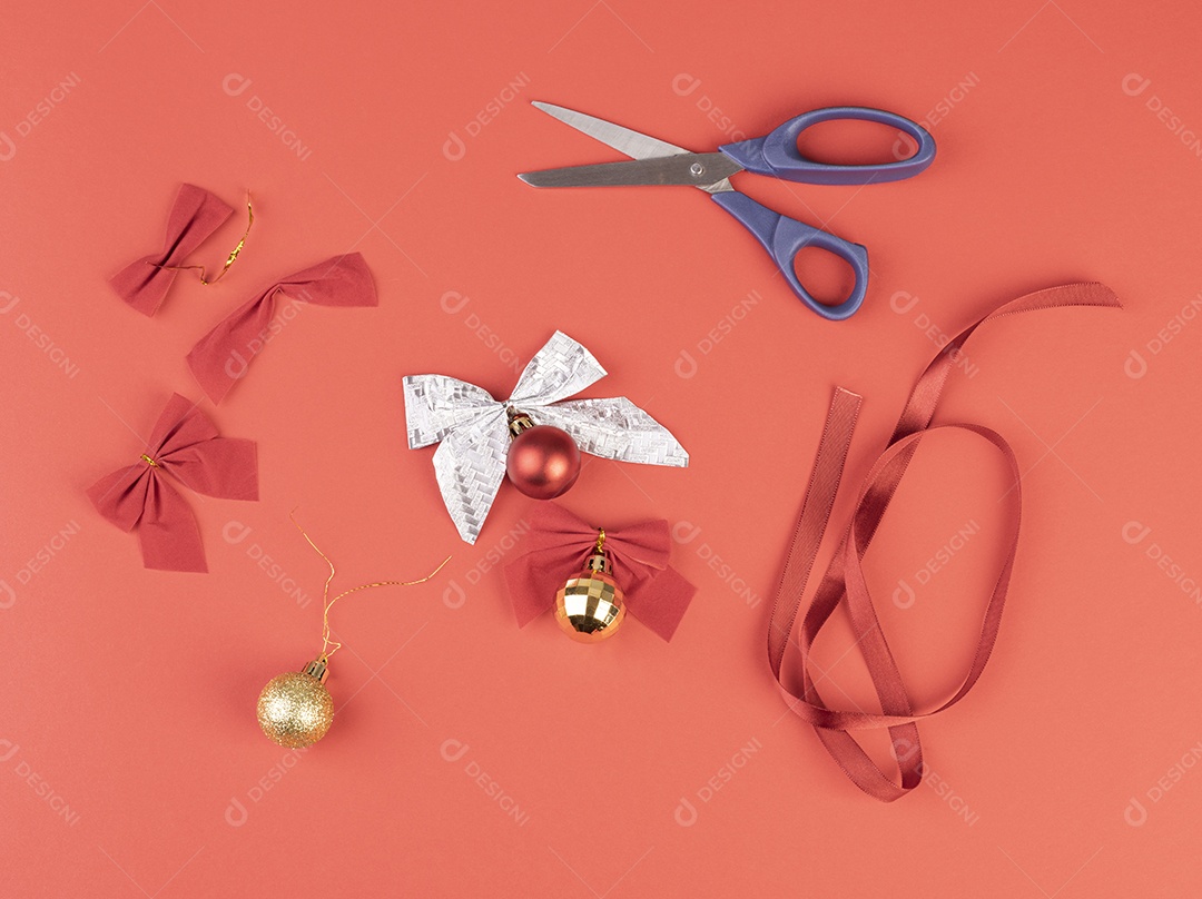 Christmas balls, bows, scissors and gift ribbon.