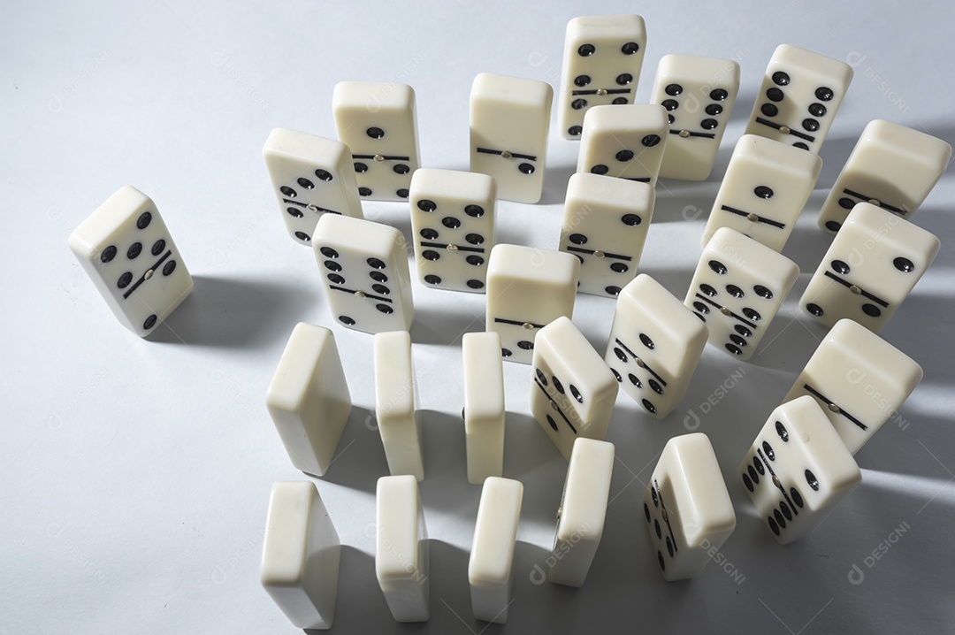 Domino pieces with white background and multiple angles table games concept
