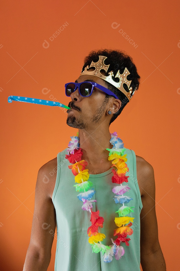 Black man in costume for brazil carnival isolated on orange background.
