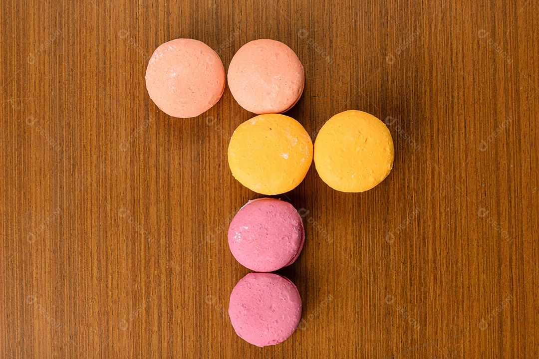 Colorful macaroons on the table, arranged in a different formation.