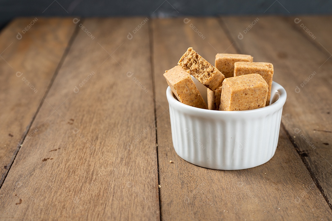 Paçoca is a Brazilian Peanut Candy. in a white bowl