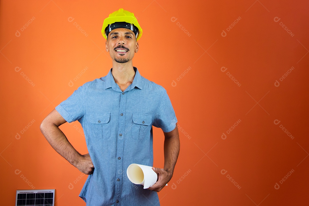 Engineers day - black man in hardhat and blue shirt isolated.
