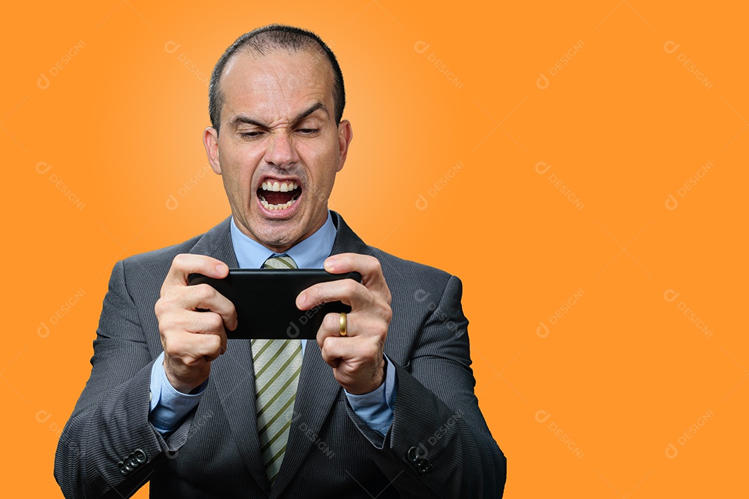 Mature man in a suit and tie playing on his smartphone