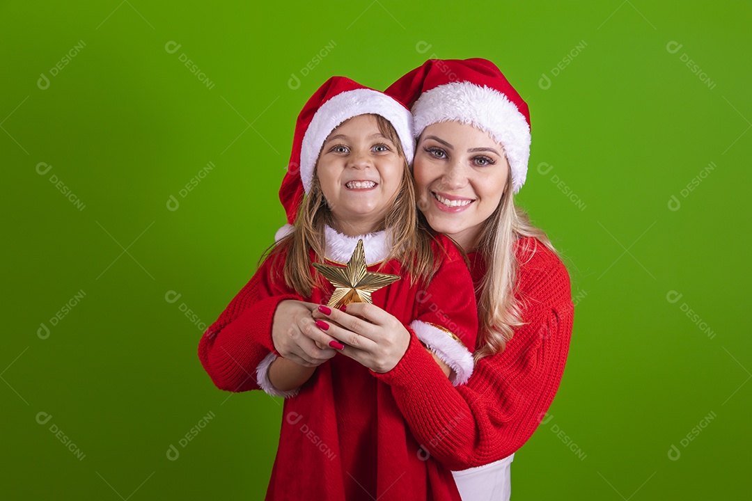 Mother and her daughter celebrating Christmas over isolated background