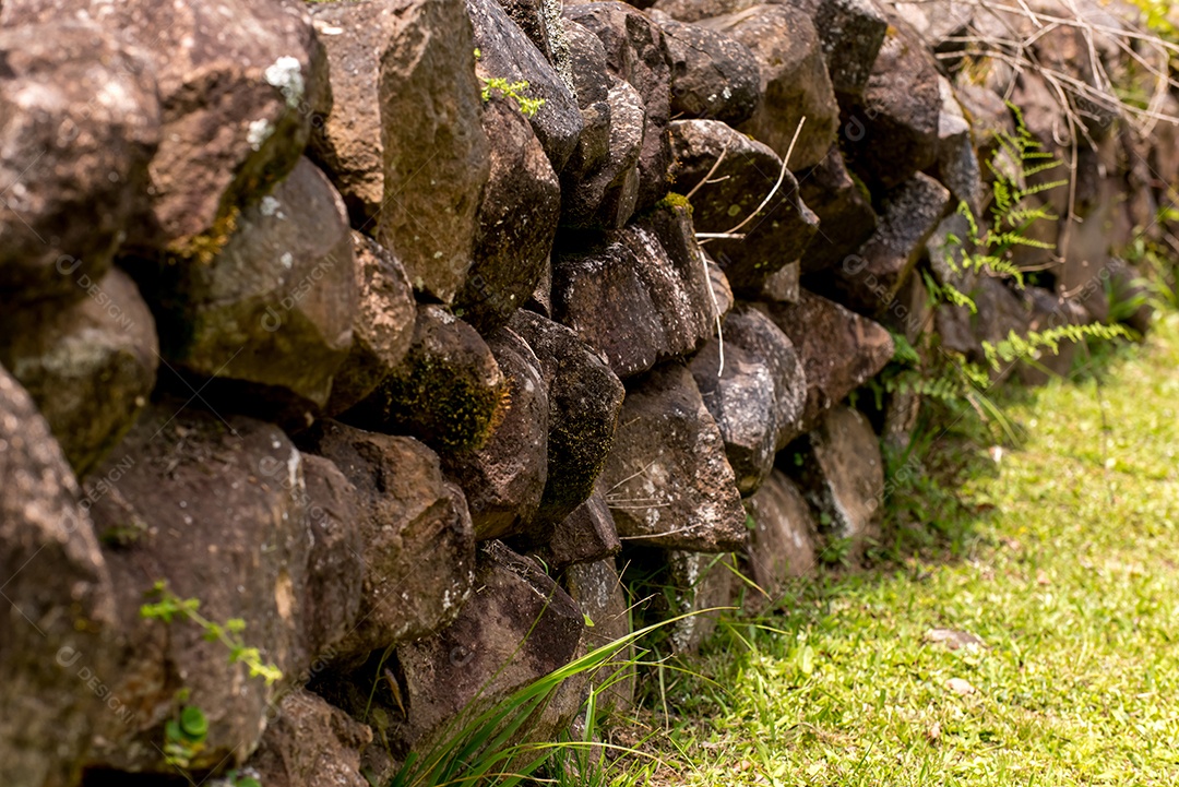Rustic stone wall in the garden.