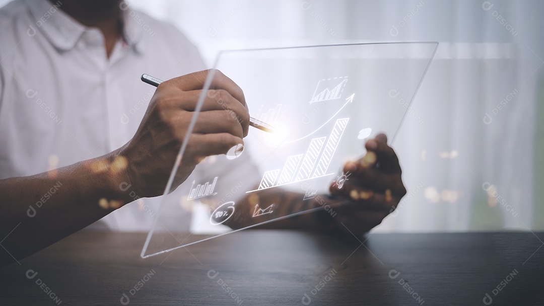 Businessman draws a rising trend arrow and a growing chart