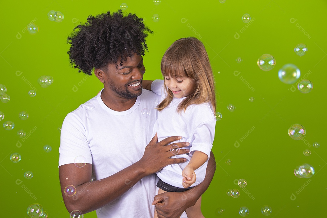 Fun uncle playing with his cute niece over isolated background