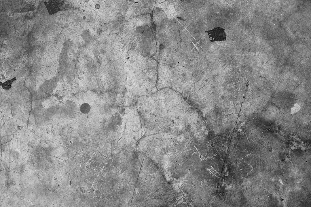 O fundo preto e cinza escuro da parede turva tem um pouco de luz abstrata