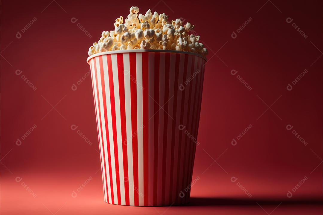 Balde de pipoca em cima de poltrona de cinema com sala e telão