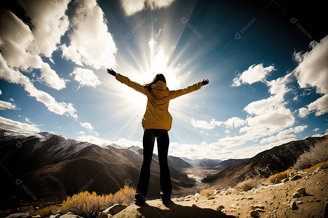 Uma pessoa de pé no topo de uma montanha, com os braços estendidos e a cabeça jogada para trás, olhando para o céu, um sentimento de imensa gratidão e apreço pelo mundo ao seu redor