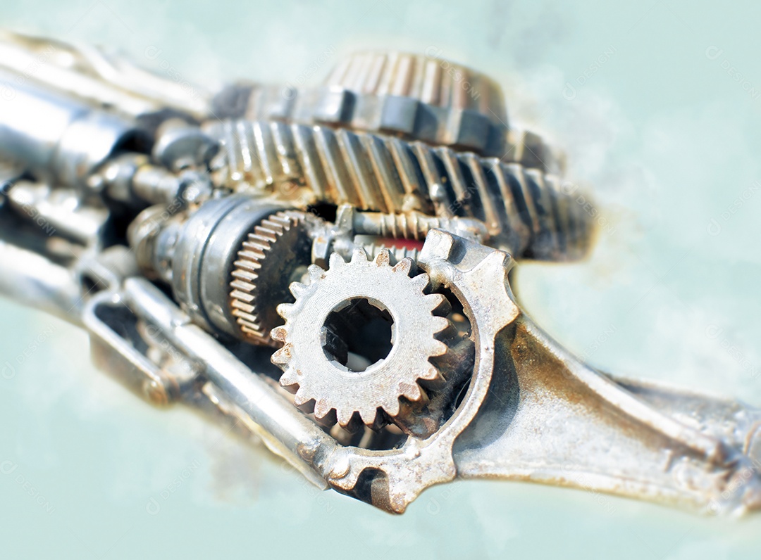 Detalhe do mecanismo com engrenagens e dentes metálicos unidos por soldagem.