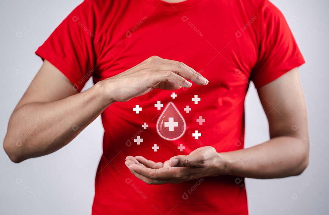 Homem segurando um ícone de sangue de doação virtual, transfusão de sangue, dia mundial do doador de sangue