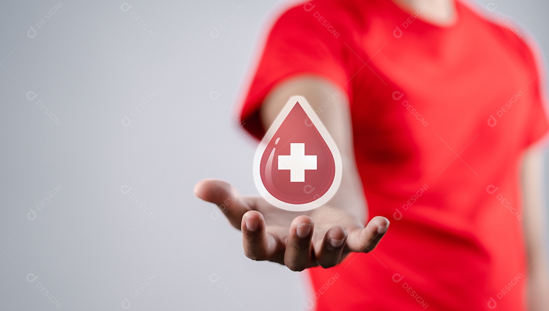 Homem segurando um ícone de sangue de doação virtual, transfusão de sangue, dia mundial do doador de sangue