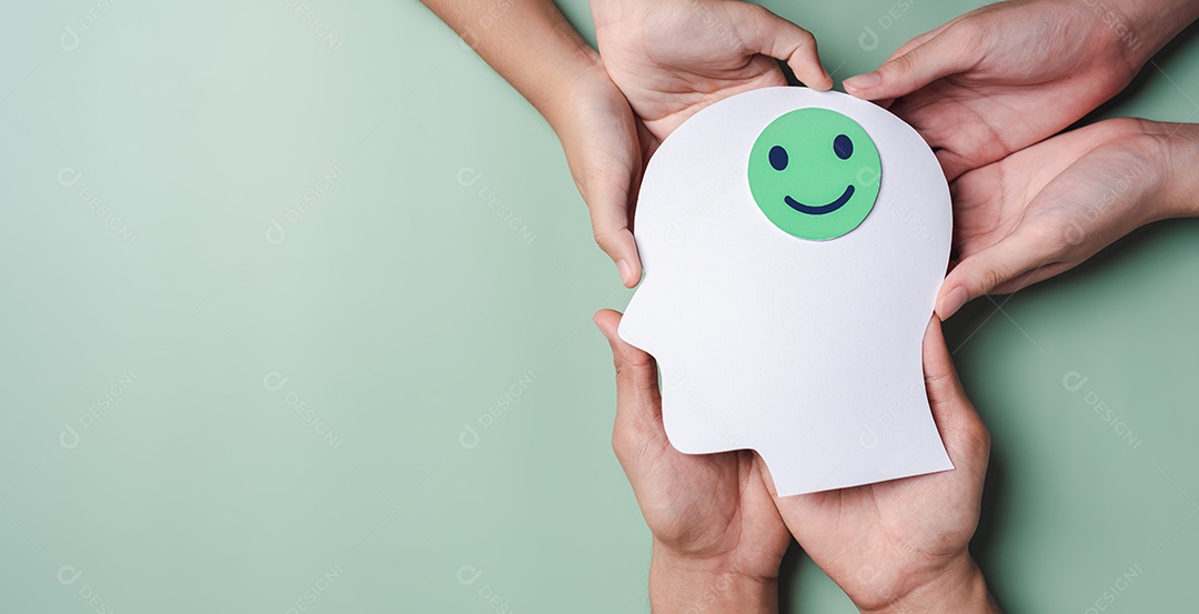 Mãos segurando um rosto sorridente em corte de papel cerebral, emoção sorridente feliz
