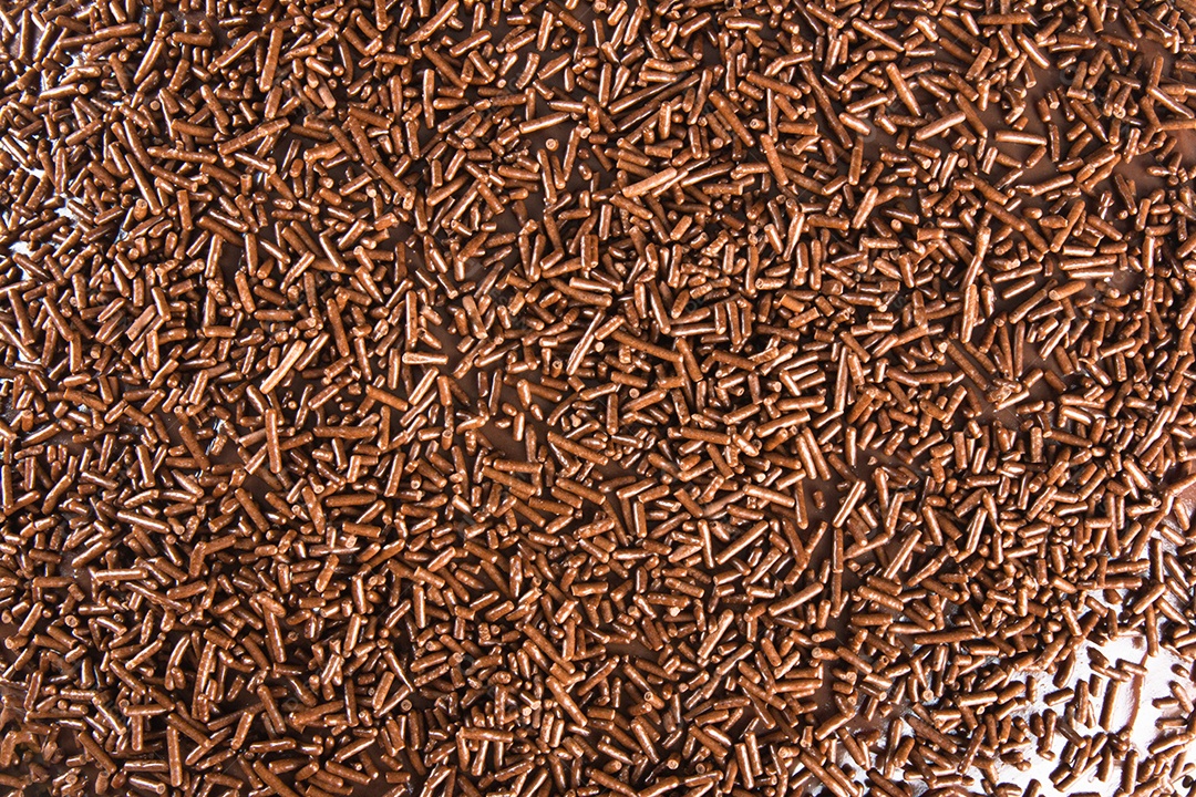 Fundo com textura de bolo de chocolate e cobertura de brigadeiro