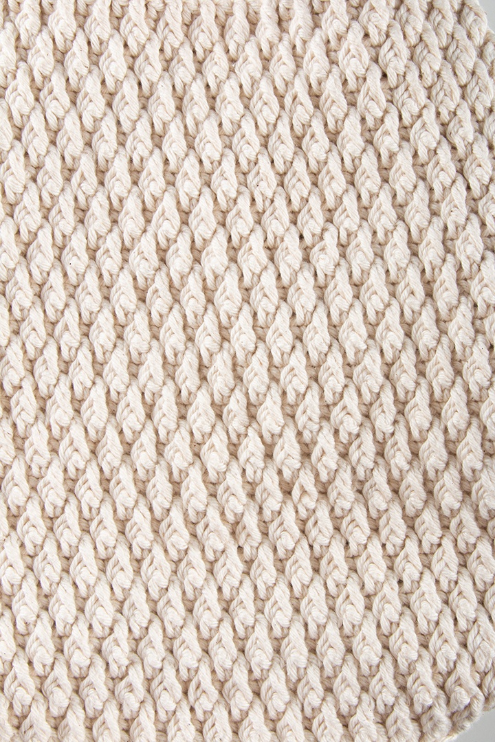 Fundo de textura de crochê branco. Feito à mão.