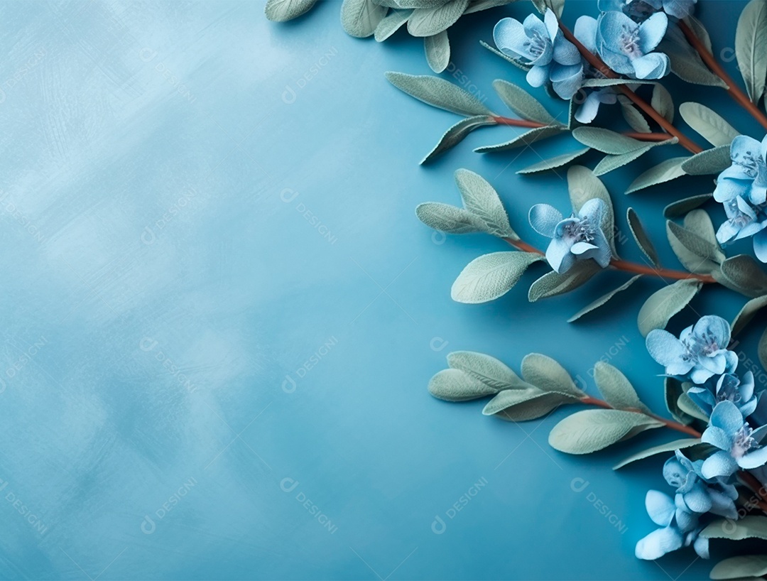 Folhas e flores sobre fundo isolado azul.