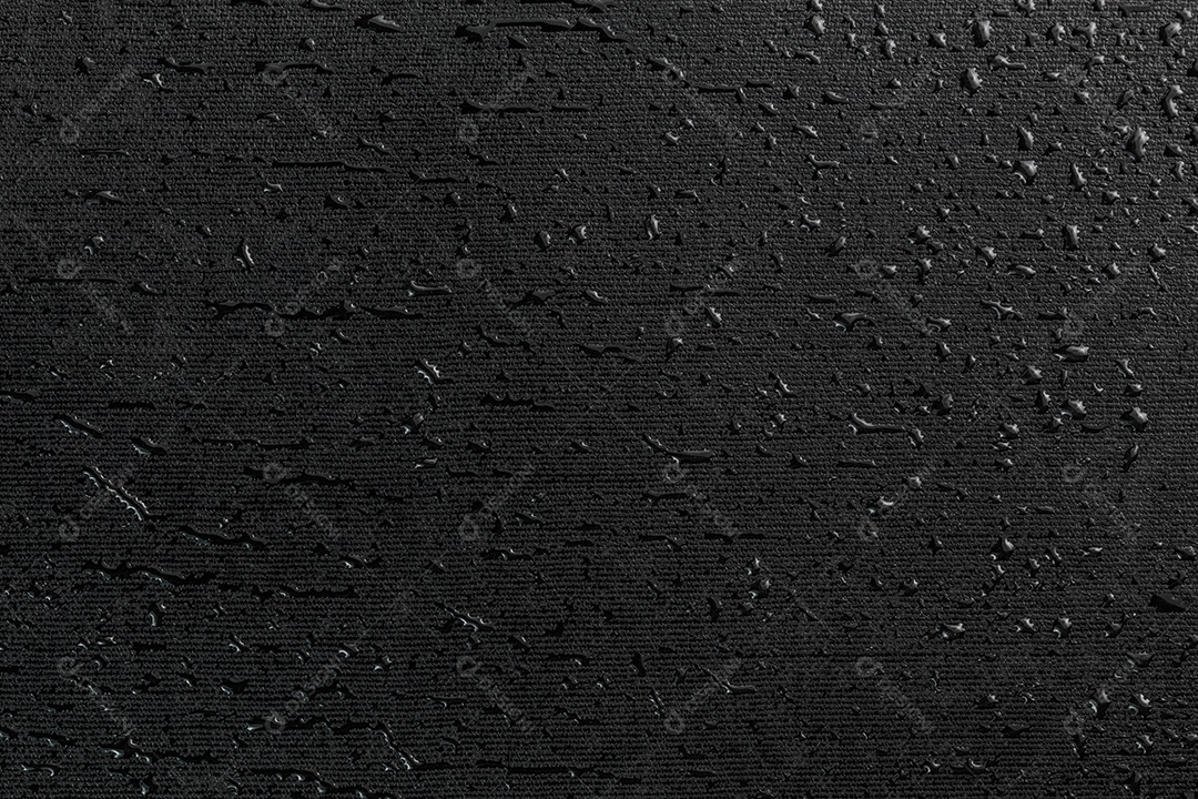 Fundo macro da superfície de borracha plana preta com gotas de água