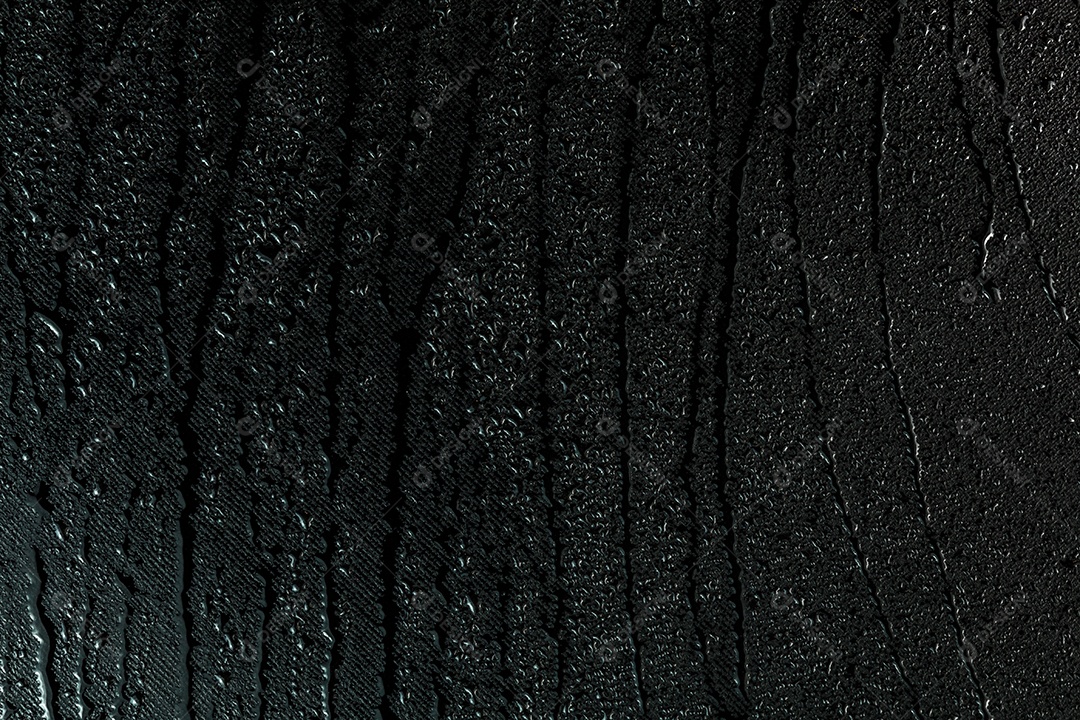 Fundo macro da superfície de borracha plana preta com gotas de água