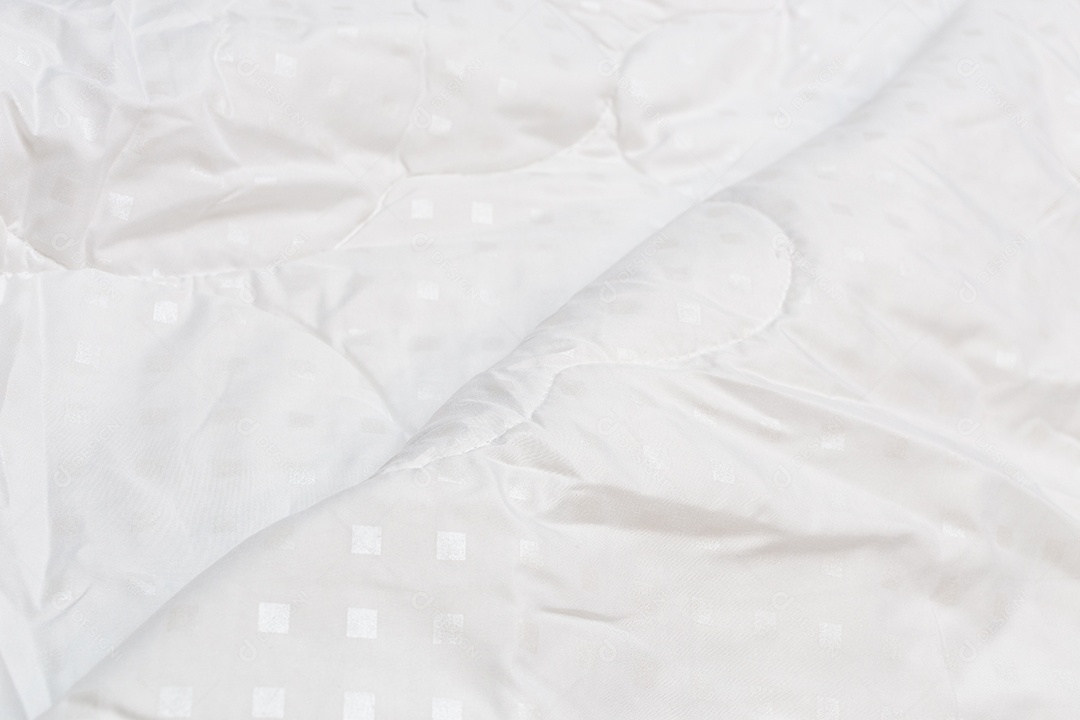 Close-up de cobertor de tecido branco com foco seletivo e desfoque de fundo