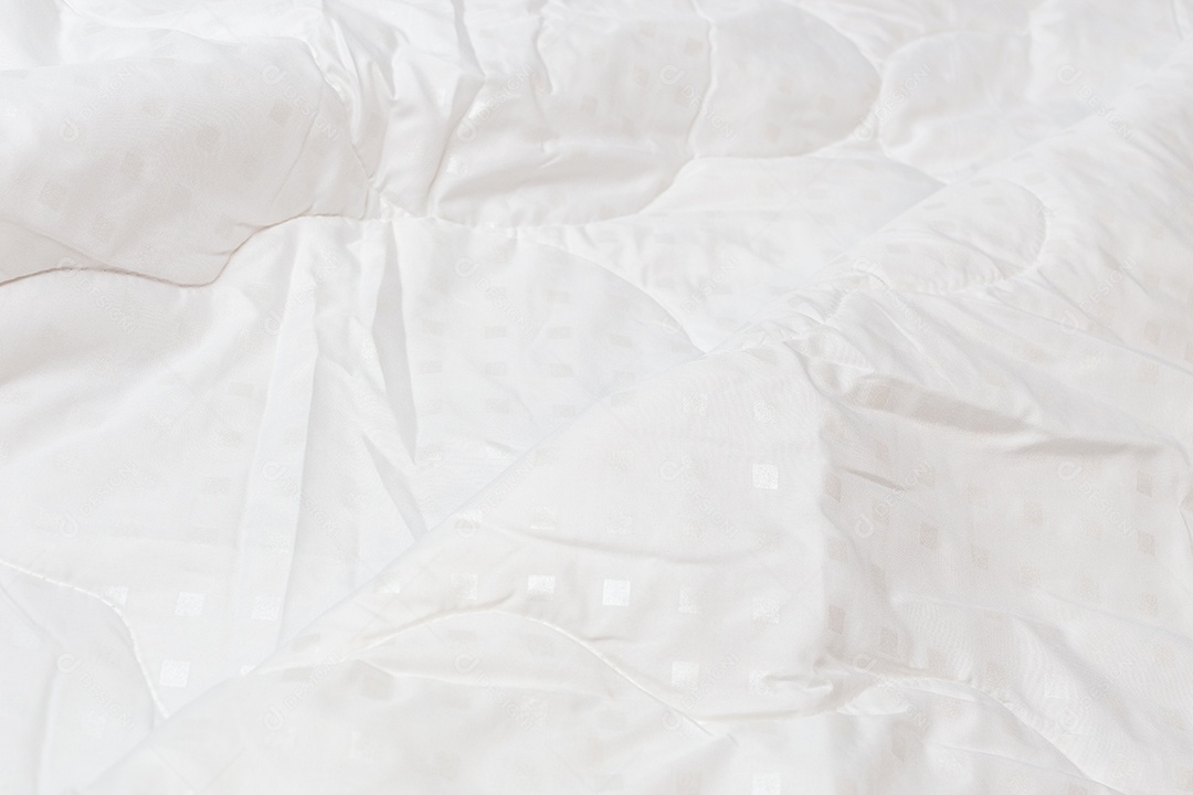 Close-up de cobertor de tecido branco com foco seletivo e desfoque de fundo