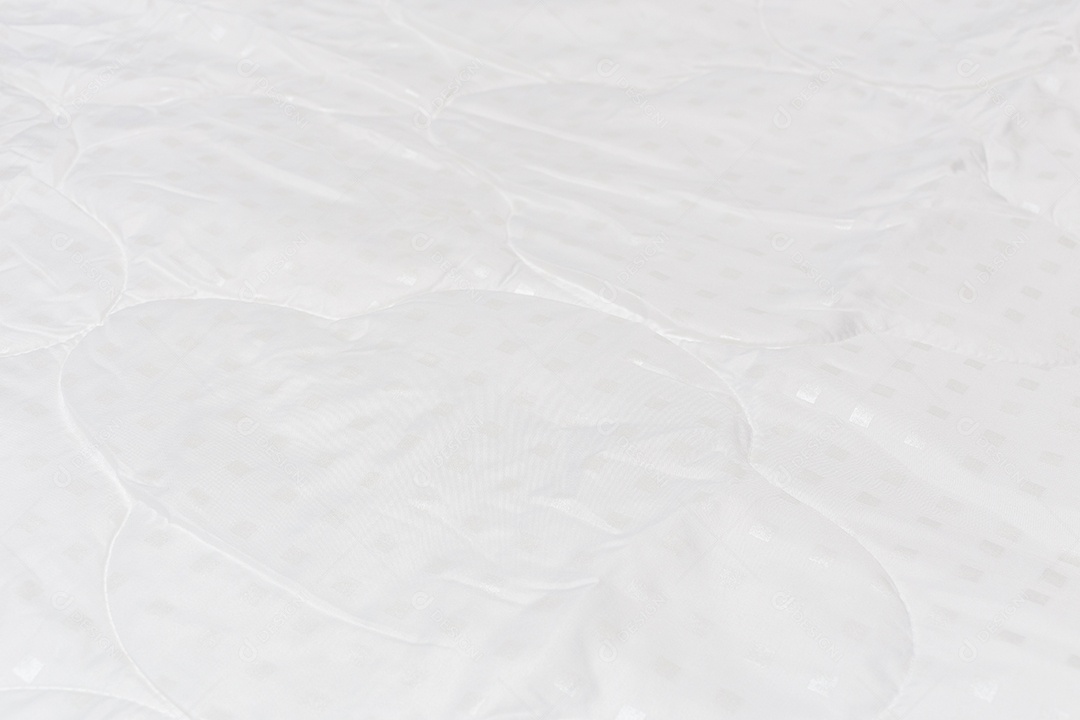 Close-up de cobertor de tecido branco com foco seletivo e desfoque de fundo