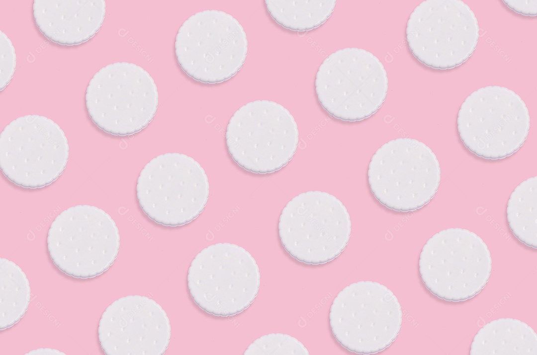 Arte criativa feita com padrão de biscoitos em fundo rosa pastel