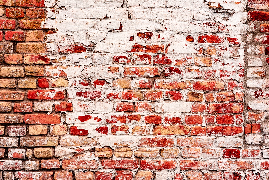 Fundo velho preto e branco da textura da parede de tijolo