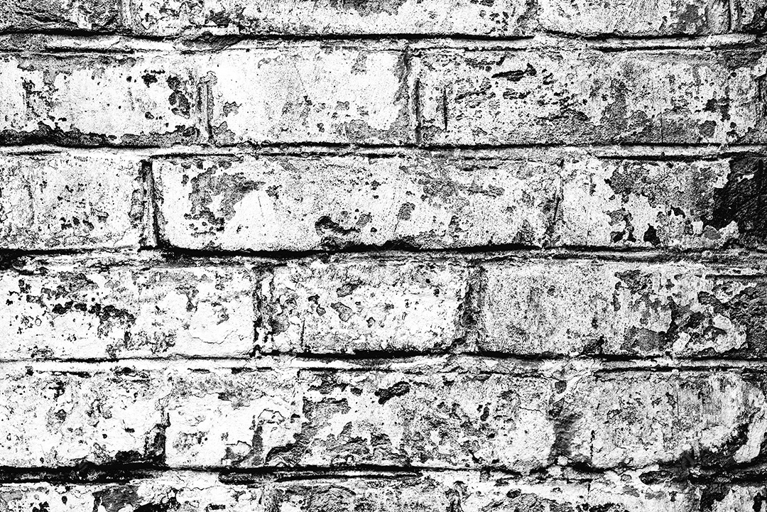 Fundo velho preto e branco da textura da parede de tijolo