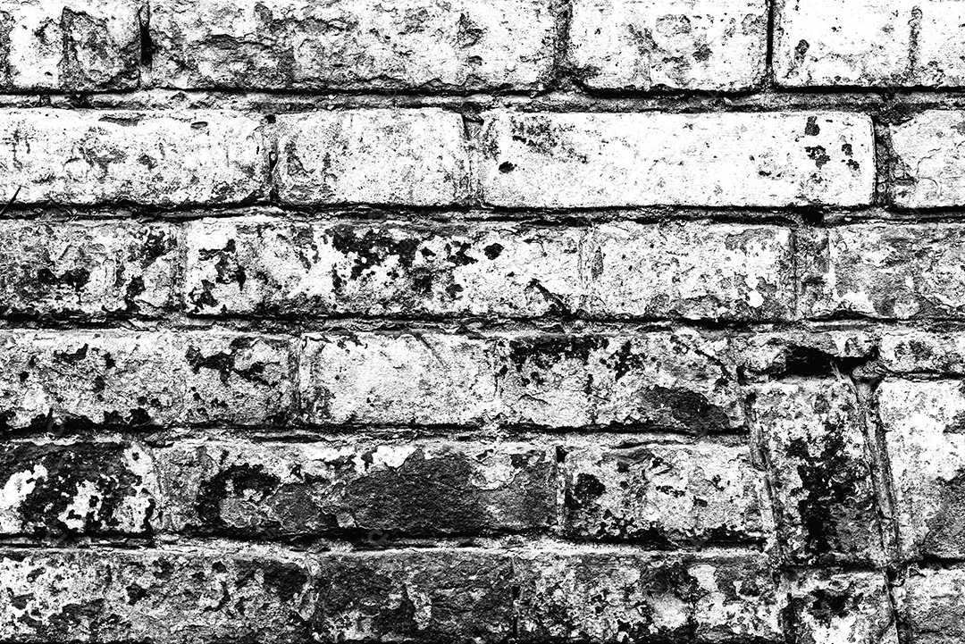 Fundo velho preto e branco da textura da parede de tijolo