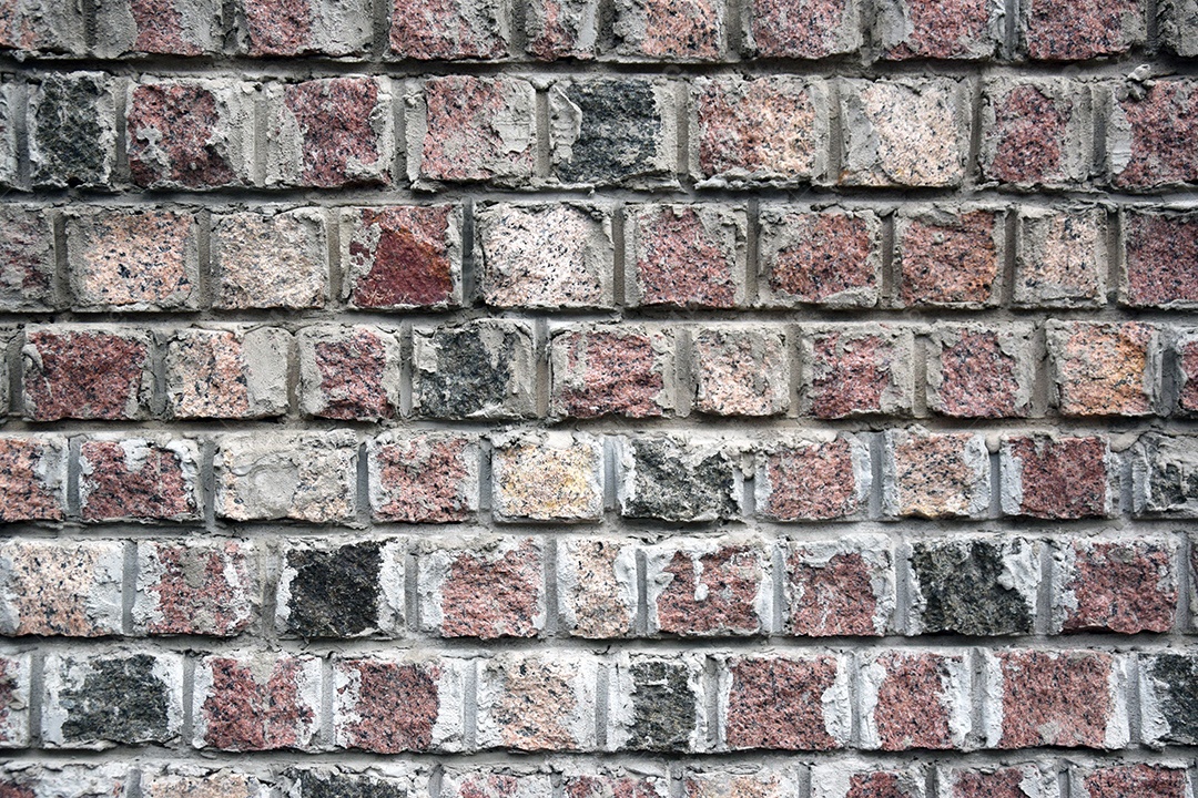 Antigo fundo retrô grunge de tijolo multicolorido