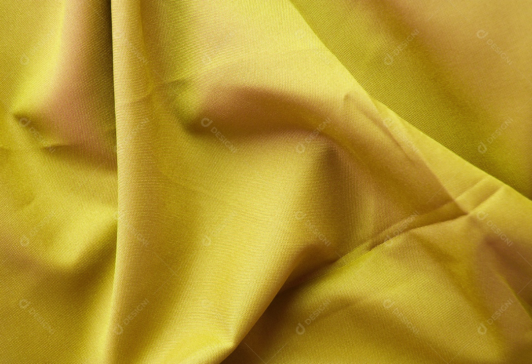 Tecido amarelo com grandes dobras abstrato
