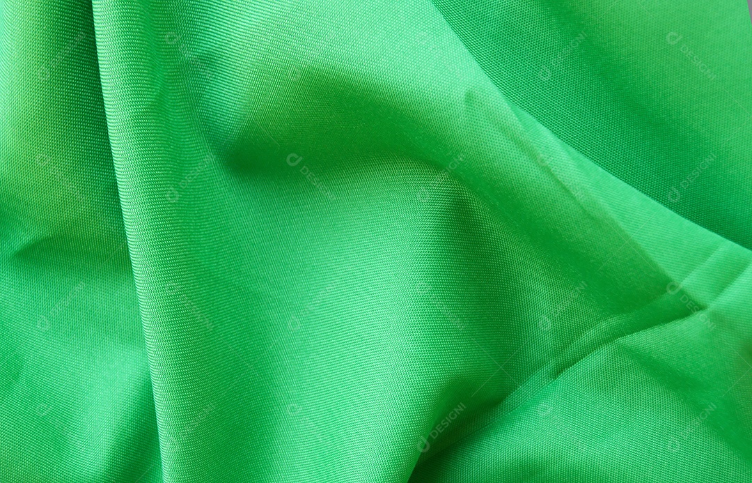 Tecido verde com grandes dobras abstrato