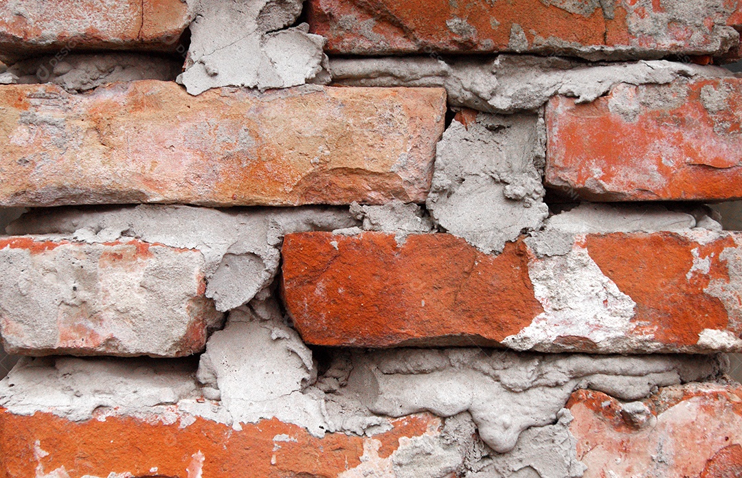 Parede de tijolos vermelhos com cimento