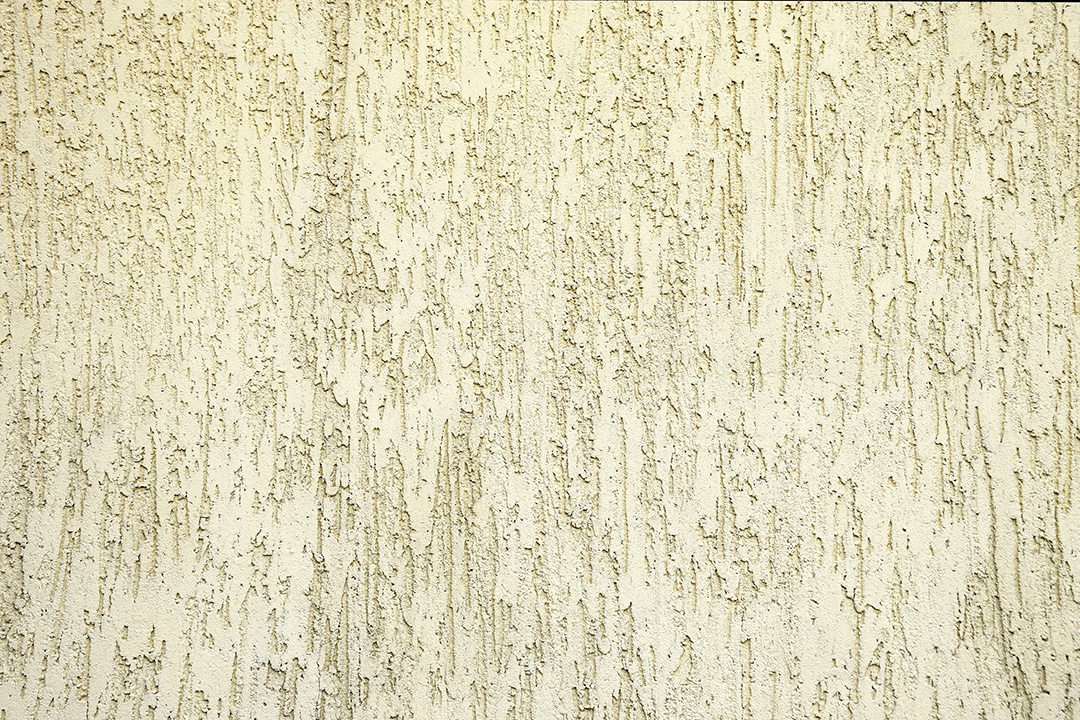 Textura de estuque ribby marfim na parede de cimento