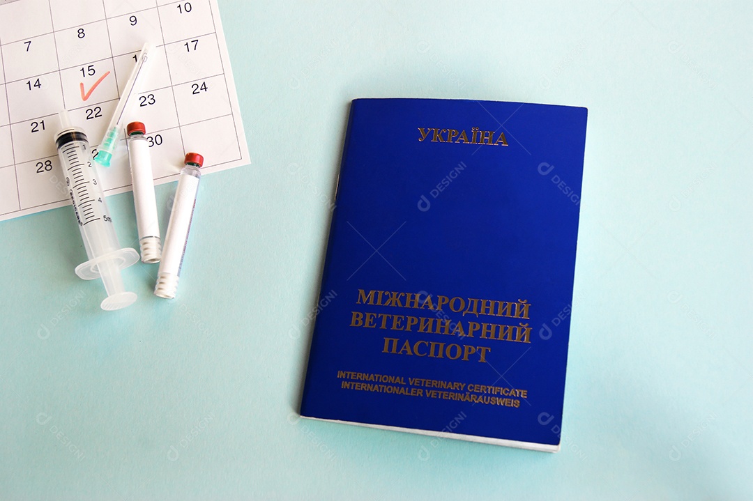 Calendário seringas tubos coletor e passaporte sobre fundo azul